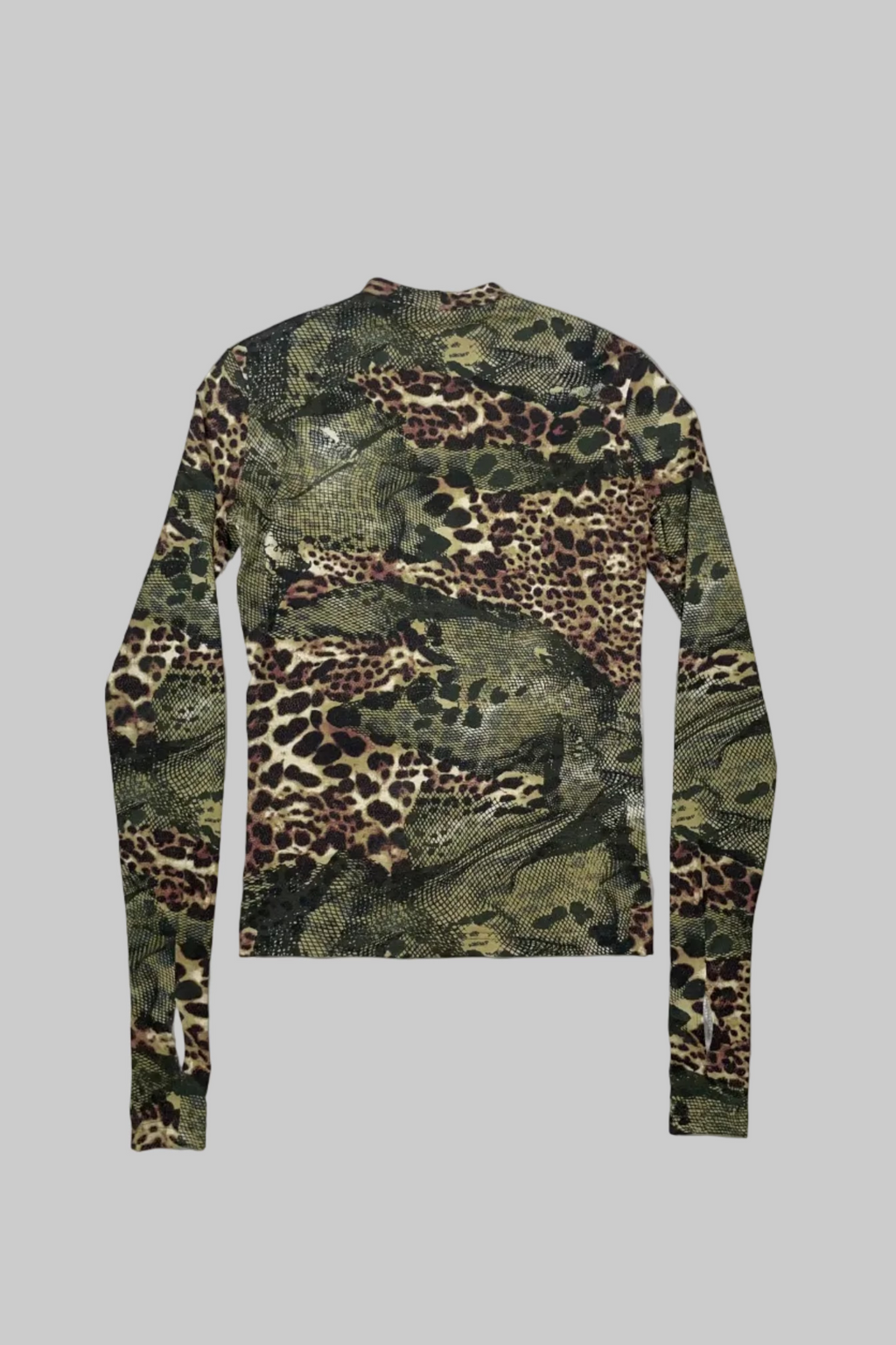 A long-sleeve crewneck shirt featuring an all-over mixed animal print pattern with leopard spots, snakeskin texture, and camouflage elements in green, brown, black, and beige, laid flat on a white wooden plank background.