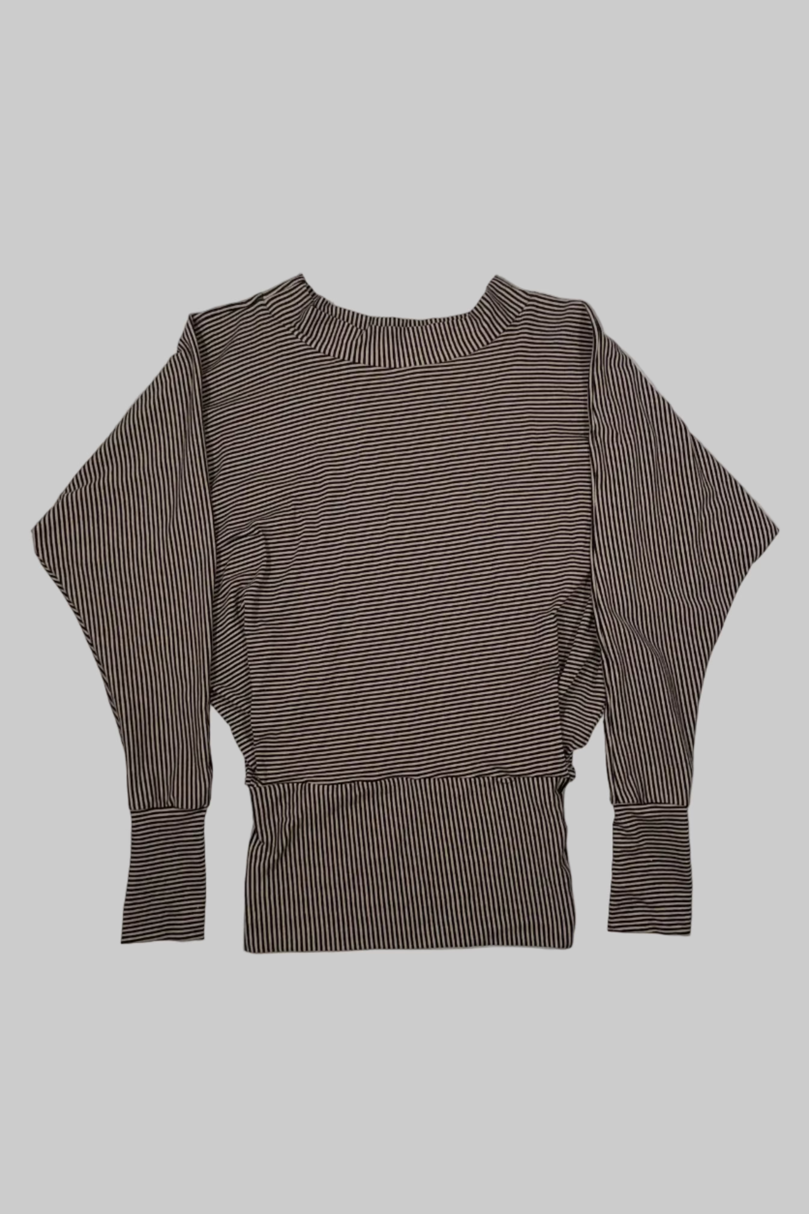 A brown and white vertically striped long-sleeve top with a high crew neck and a structured, slightly fitted silhouette, laid flat against a white painted wood plank background.