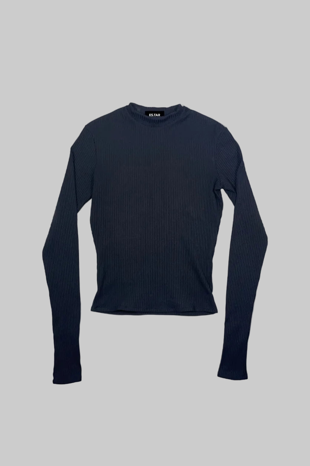 A black ribbed long-sleeve mock neck top laid flat on a white painted wooden background.